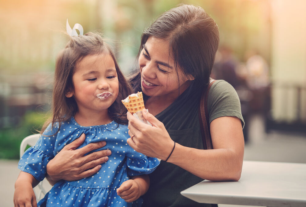 mom eating ice cream with child