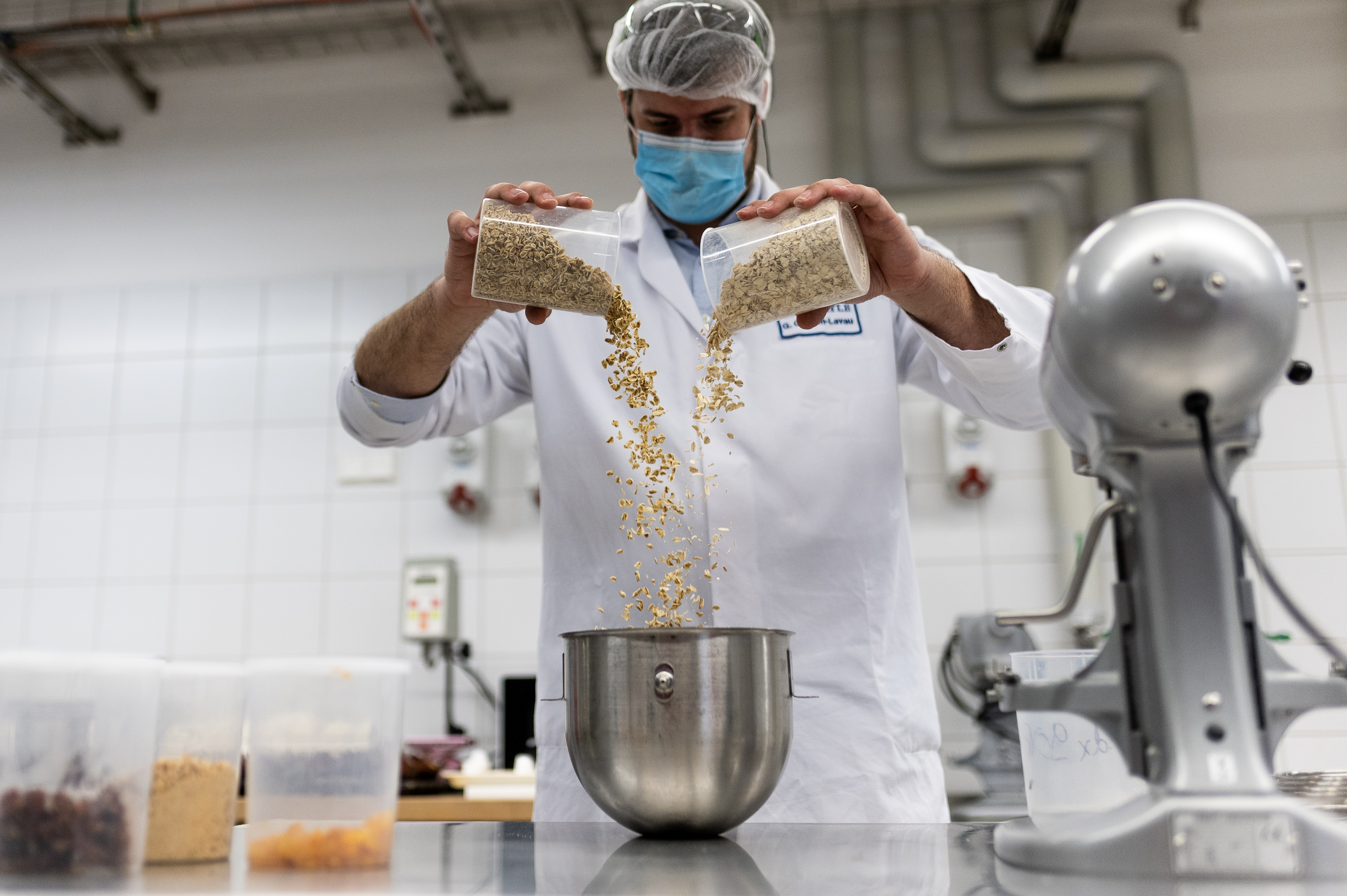 Food scientist combining ingredients