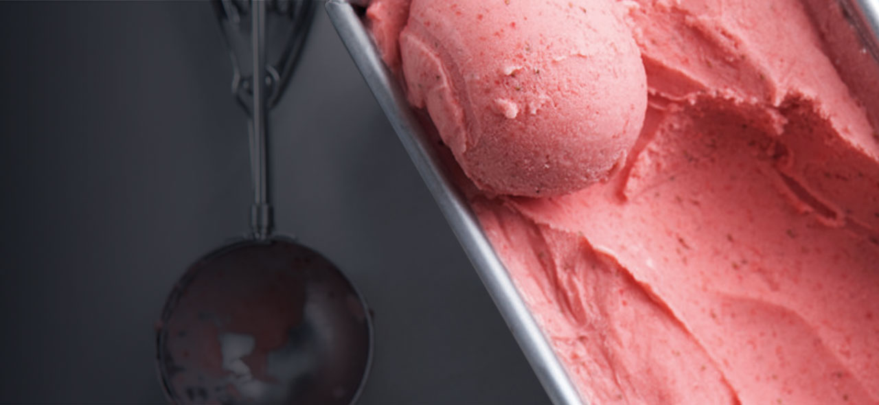 Close-up of low-sugar strawberry ice cream and scoop