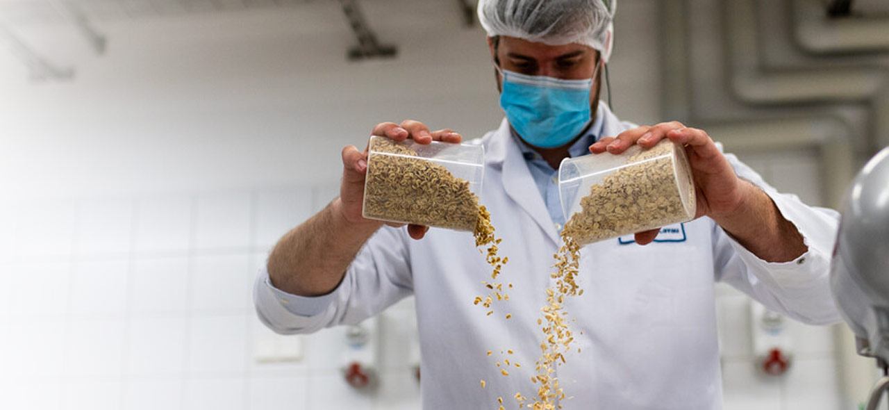 Scientist man pouring ingredients from a height