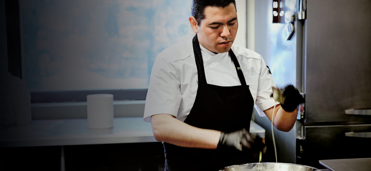 Food technician mixing ingredients
