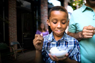 Child with bowl of ice cream