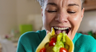 11673_Main Page IMGs_1153x300_Woman eating Taco (1).jpg 