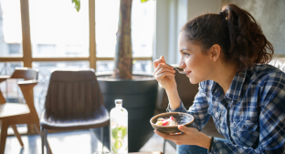 Woman eating yoghurt