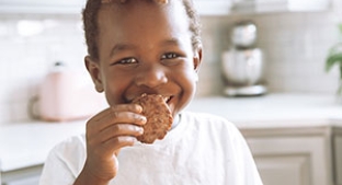 Child eating reduced sugar snack