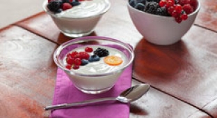 two bowl of white with red and black berries with a bowl of berries