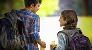 Two children facing away from the camera with drinks containing Tate & Lyle ingredients