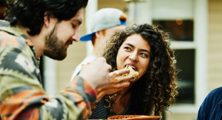 Woman eating with friend