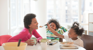Mum and two children having breakfast