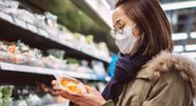 Consumer browsing supermarket produce