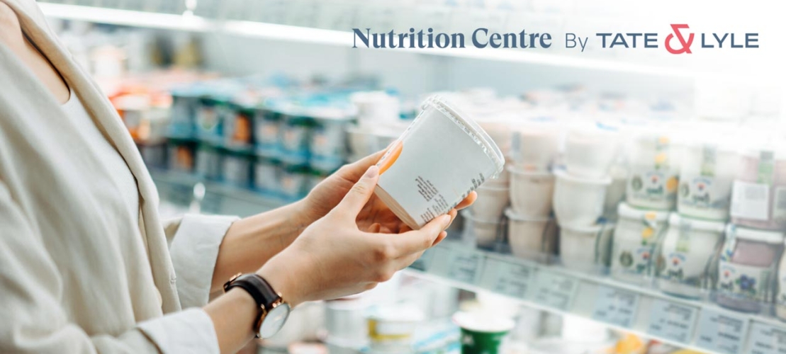 Woman examining dairy labelling