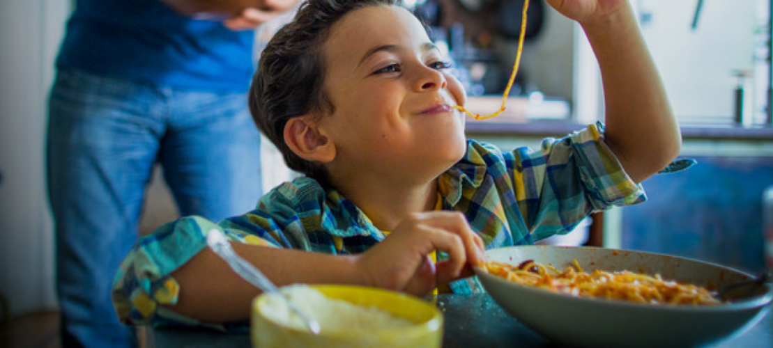 boy eating spaghetti