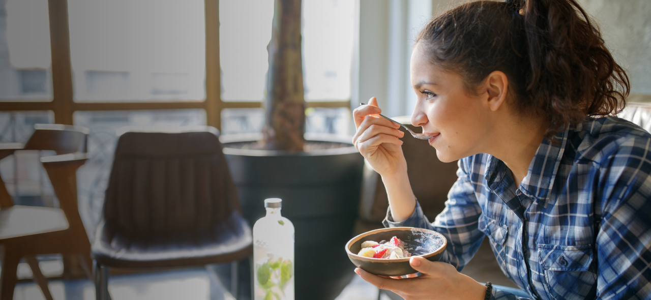 Woman eating yoghurt