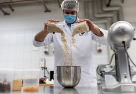 Food scientist combining ingredients