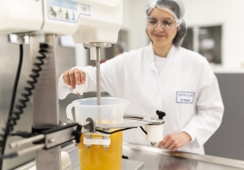 Food scientist mixing beverage formulation